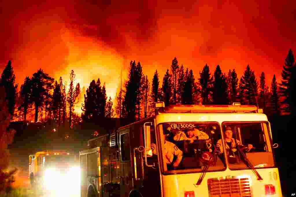 Firefighters arrive at Frenchman Lake to battle the Sugar Fire, part of the Beckwourth Complex Fire, burning in Plumas National Forest, California, July 8, 2021.