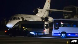 A Falcon 900 of the Swiss Air Force presumed to be carrying carrying American prisoners released by Iran is pictured on the tarmac of Geneva's airport, on Jan. 17, 2016. (AFP / Richard Juilliart)