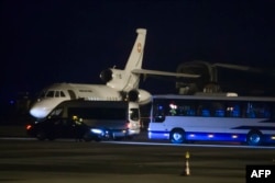 FILE - A Falcon 900 of the Swiss Air Force presumed to be carrying carrying American prisoners released by Iran is pictured on the tarmac of Geneva's airport, Jan. 17, 2016.