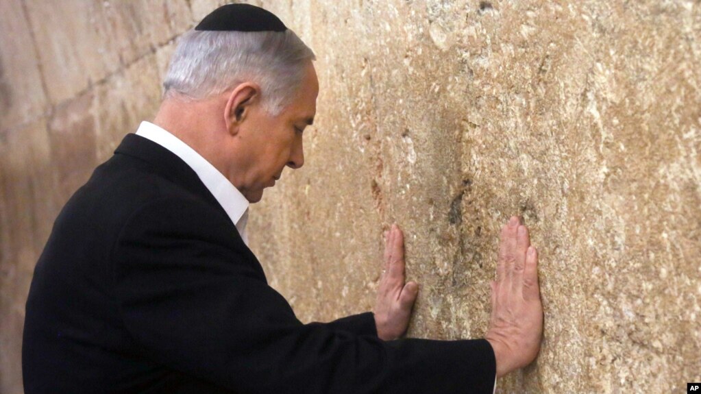 Israeli Prime Minister Benjamin Netanyahu prays at the Western Wall in Jerusalem's Old City, Feb. 28, 2015.