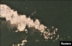 Gold mining deforestation is seen from a satellite image in the southern Amazon region of Madre de Dios, Peru. This is an undated handout photo provided by Matt Finer, obtained by Reuters June 21, 2018.