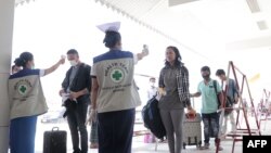 မတ်လ ၂၃ ရက်နေ့တုန်းက ထိုင်း-မြန်မာနယ်စပ်မှ ပြန်လာကြသူများ 