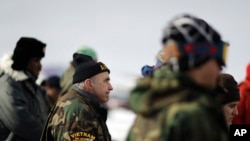 FILE - Vietnam Army veteran Dan Luker of Boston attends a briefing for fellow veterans at the Oceti Sakowin camp where people have gathered to protest the Dakota Access oil pipeline in Cannon Ball, N.D., Dec. 3, 2016. 