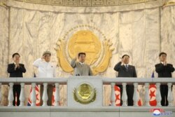 North Korea leader Kim Jong Un (C) attends a paramilitary parade held to mark the 73rd founding anniversary of the republic at Kim Il Sung square in Pyongyang in this undated image supplied by North Korea's Korean Central News Agency on Sept. 9, 2021. (K