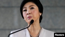 Thai Prime Minister Yingluck Shinawatra faces the media during a news conference at The Army Club in Bangkok, Dec. 10, 2013. 