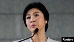 FILE - Thai Prime Minister Yingluck Shinawatra faces the media during a news conference at The Army Club in Bangkok, Dec. 10, 2013. 