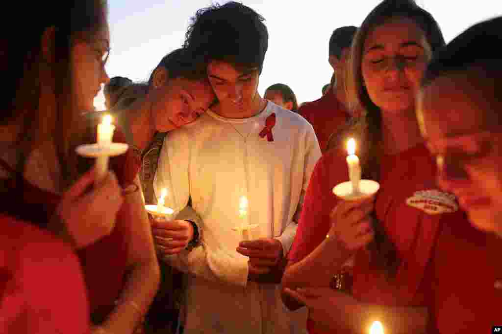 Students gather during a vigil at Pine Trails Park for the victims of the Wednesday shooting at Marjory Stoneman Douglas High School, in Parkland, Fla., Feb. 15, 2018. 