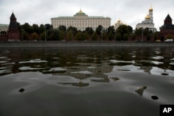 The Kremlin with its palaces and churches is reflected in the Moskva River waters in Moscow, Russia, Sept. 30, 2016. Russia has entered a second year of its military operation in Syria.