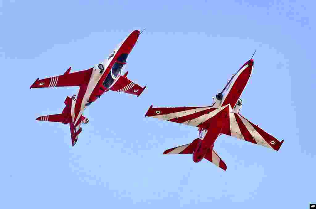 Indian Air Force Suryakiran aircraft perform moves in the air on the third and final day of the Aero India 2021, at Yelahanka air base in Bengaluru, India.