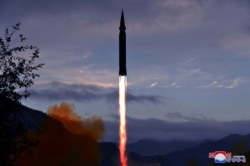 The hypersonic missile Hwasong-8 is test-fired by the Academy of Defence Science of the DPRK in Toyang-ri, Ryongrim County of Jagang Province, North Korea, in this undated photo released on September 29, 2021 by KCNA