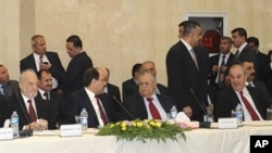 Leaders of Iraq's main political blocs, front row, from left to right: former Iraqi Prime Minister Ibrahim Jafari, Iraqi Prime Minister Nouri al-Maliki, Iraqi President Jalal Talabani and former Iraqi Prime Minister Ayad Allawi, are seen during their meet