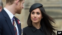 Britain's Prince Harry and Meghan Markle attend a Service of Thanksgiving and Commemoration on ANZAC Day at Westminster Abbey in London, April 25, 2018.