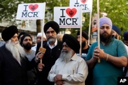 Members of the Manchester Sikh Community attend a vigil in Albert Square, Manchester, England, May 23, 2017, the day after the suicide attack at an Ariana Grande concert that left 22 people dead as it ended on Monday night.