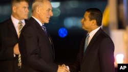 Guatemala's Foreign Minister Carlos Morales, right, receives U.S. Secretary of Homeland Security John F. Kelly, at La Aurora Air Force Base, in Guatemala City, Feb. 21, 2017. 