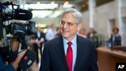 Judge Merrick Garland, President Barack Obama's choice to replace the late Justice Antonin Scalia on the Supreme Court arrives for a meeting with Sen. Angus King, I-Maine, on Capitol Hill in Washington, April 13, 2016. 