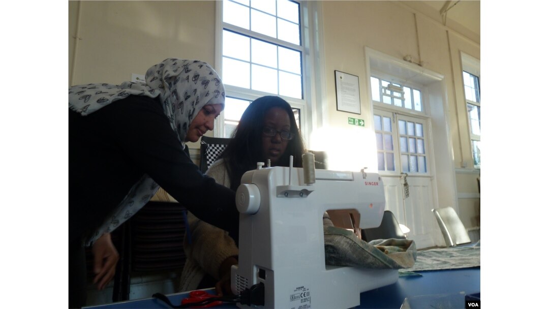 Suhad el Marsomi, an Iraqi refugee, teaches sewing while she awaits a decision on her asylum application, October 12, 2016. “Even if (it is for) free, it’s not a problem for me," she said. "Just I want to feel I’m human. I’m still human. I’m still in the life.”