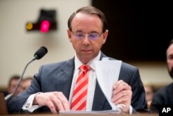 FILE - Deputy Attorney General Rod Rosenstein appears before a House Judiciary Committee hearing on Capitol Hill in Washington, June 28, 2018. By law, Rosenstein should have succeeded fired attorney general Jess Sessions but the Justice Department presented a differing legal opinion.