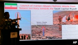 Col. Turki al-Malki, spokesman for the Saudi-led coalition fighting Huthi forces, points to a screen showing what he said was evidence of Iranian intervention and support to the Huthi in Yemen during a news conference in Mecca, Saudi Arabia, May 31, 2019.