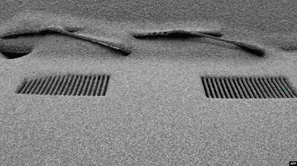 A car is completely covered in volcanic ash in San Carlos de Bariloche, southern Argentina, The wind carried ash across the Andes to Argentina. (AP Photo/Alfredo Leiva)
