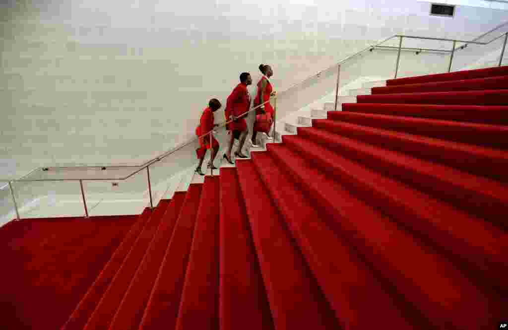 Members of Delta Sigma Theta Sorority, Inc. climb the red-carpeted stairs at the North Carolina General Assembly in Raleigh, North Carolina, May 3, 2017.