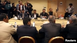 FILE - Yemen's warring parties attend a new round of talks to discuss a prisoners swap deal, in Amman, Jordan, Feb. 5, 2019. 