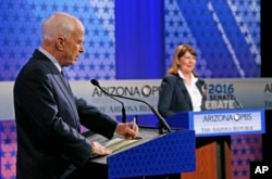 Sen. John McCain, left, debates Rep. Ann Kirkpatrick during recent Senate debate.