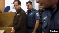 Iranian-Belgian citizen Ali Mansouri is seen arriving at a courtroom at the magistrate's court in Petah Tikva near Tel Aviv September 30, 2013.
