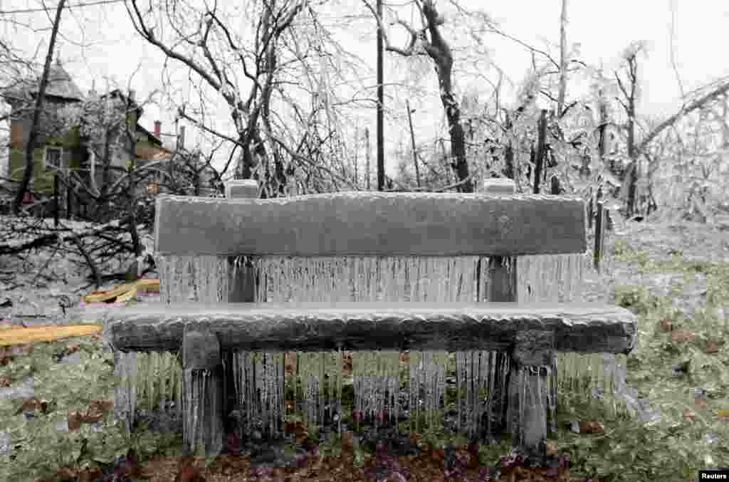 A bench covered in ice on Buda Hills in Budapest. Tens of thousand of homes on the outskirts of Budapest went without electricity this week as freezing rain blanketed the area and falling trees cut power lines, Hungary&#39;s Disaster Relief Agency said.