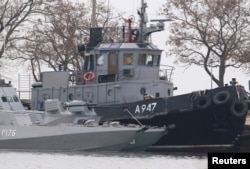 FILE - Seized Ukrainian navy vessels are seen anchored in the port of Kerch, in Russia-annexed Crimea, Nov. 26, 2018.