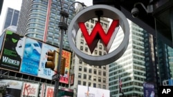 FILE - The logo for the W Hotel, owned by Starwood Hotels & Resorts Worldwide, in New York's Times Square, July 31, 2013. The information of as many as 500 million guests at Starwood hotels has been compromised.