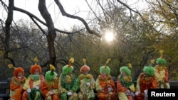 Clowns gather before the 89th Macy's Thanksgiving Day Parade in the Manhattan borough of New York, November 26, 2015.