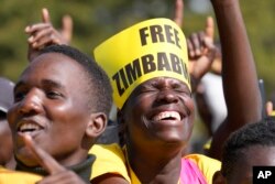 FILE - Supporters of Zimbabwe's main opposition leader Nelson Chamisa adresses are seen at a rally on the outskirts of Harare on July 26, 2023.