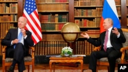 FILE - U.S. President Joe Biden, left, and Russia's President Vladimir Putin meet for the U.S.-Russia summit at Villa La Grange in Geneva, Switzerland, June 16, 2021. 