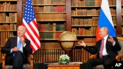 FILE - U.S. President Joe Biden, left, and Russia's President Vladimir Putin meet for the U.S.-Russia summit at Villa La Grange in Geneva, Switzerland, June 16, 2021.