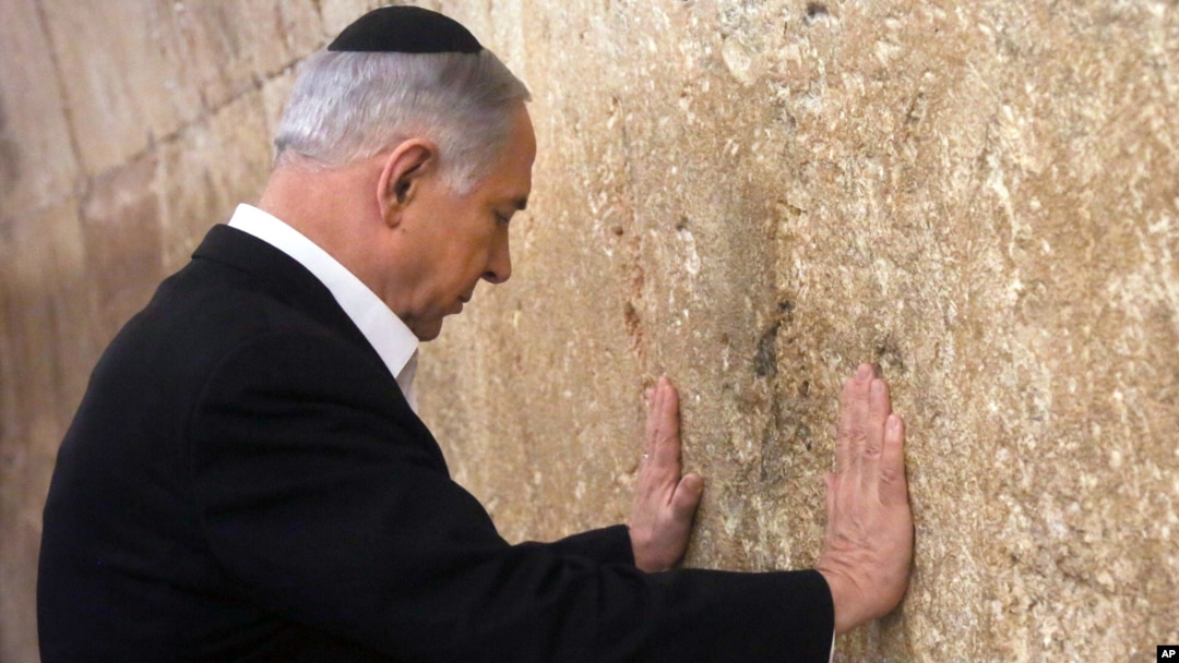 Israeli Prime Minister Benjamin Netanyahu prays at the Western Wall in Jerusalem's Old City, Feb. 28, 2015.