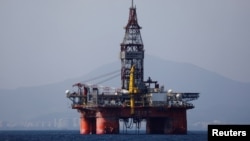 FILE - An oil platform operated by China National Offshore Oil Corporation (CNOOC) is seen in the sea off China's southernmost Hainan province, March 23, 2018.