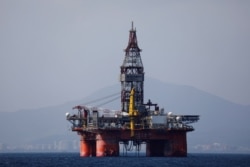 FILE - An oil platform operated by China National Offshore Oil Corporation (CNOOC) is seen in the sea off China's southernmost Hainan province, March 23, 2018.