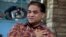 FILE - Ilham Tohti, an outspoken scholar of China's Turkic Uighur ethnic minority, speaks during an interview at his home in Beijing, China.