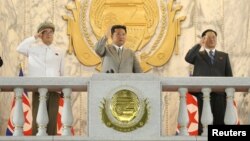 North Korea leader Kim Jong Un (C) attends a paramilitary parade held to mark the 73rd founding anniversary of the republic at Kim Il Sung square in Pyongyang in this undated image supplied by North Korea's Korean Central News Agency on Sept. 9, 2021. (K