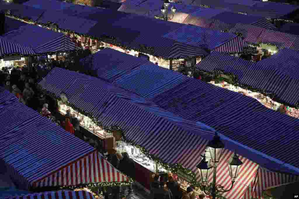 Visitors wait for the opening of the traditional Christmas market at the Old Town in Nuremberg, Germany.