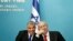 FILE - Israeli Prime Minister Benjamin Netanyahu (R) and Finance Minister Yair Lapid smile during a joint news conference in Jerusalem, July 2013.