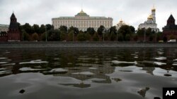 The Kremlin with its palaces and churches is reflected in the Moskva River waters in Moscow, Russia, Sept. 30, 2016. Russia has entered a second year of its military operation in Syria.