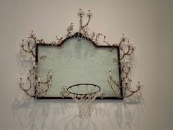 A crystal chandelier shaped as a basketball net by Black American artist David Hammons. (L. Bryant/VOA)
