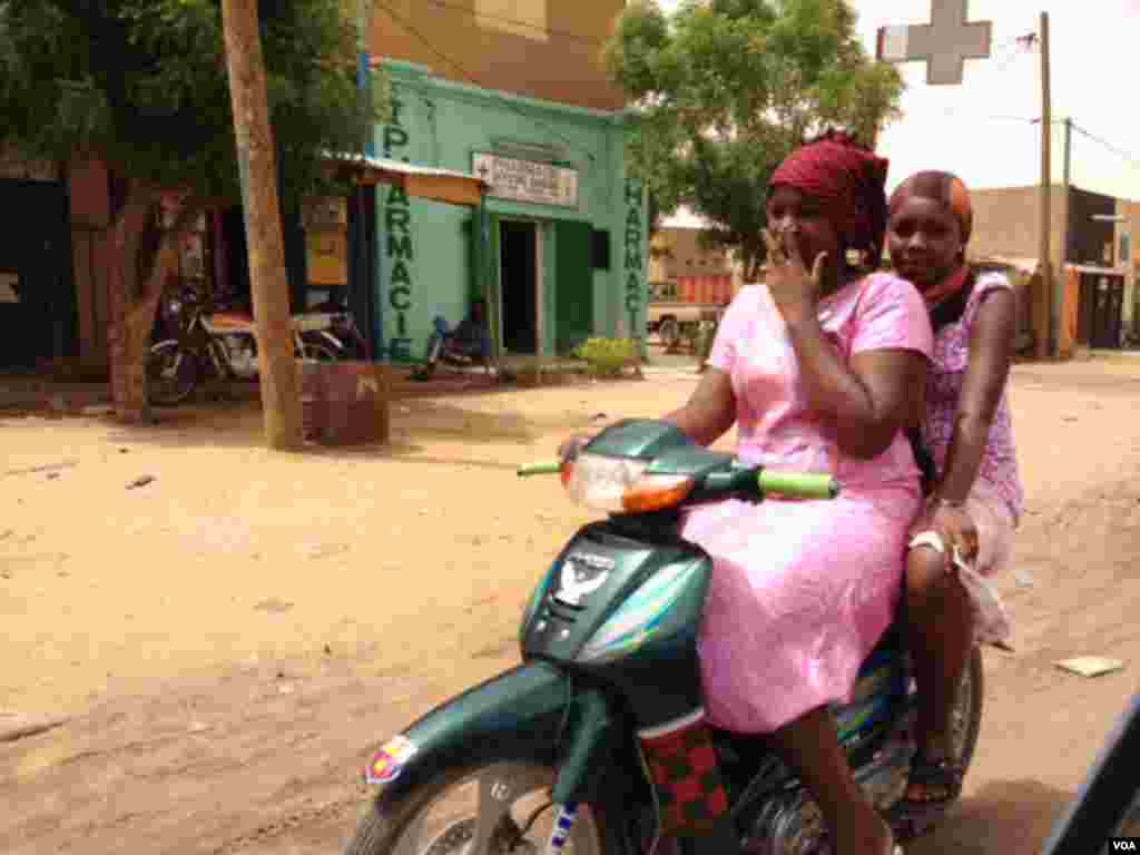 Two Gao women residents on a motorcycle. (Idriss Fall/VOA)