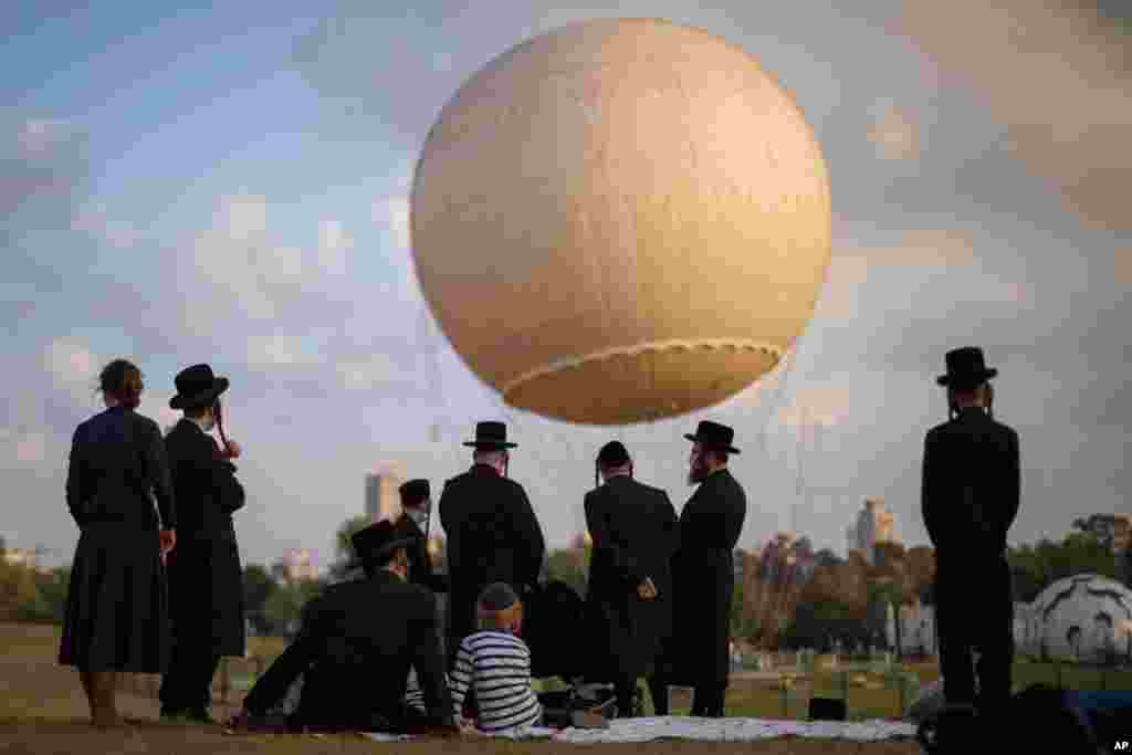 Ultra-Orthodox Jews enjoy their day in a park in Tel Aviv, Israel.