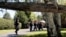 Corrections officers walk through a residential area in Malone, N.Y., during a search for two escaped prisoners from the Clinton Correctional Facility, June 24, 2015,