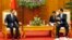 Chinese State Councilor Yang Jiechi (L) listens to Vietnamese Prime Minister Nguyen Tan Dung in Hanoi June 18, 2014.