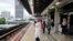 People wait for a Light Rail Transit train at a station, during a lockdown due to the coronavirus disease (COVID-19) outbreak, in Kuala Lumpur, Malaysia, Jan. 14, 2021.