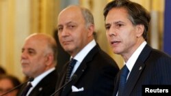 Dari kiri ke kana: PM Irak Haider al-Abadi, Menlu Perancis Laurent Fabius dan Wakil Menlu AS Antony Blinken dalam pertemuan di Paris, Perancis (2/6).