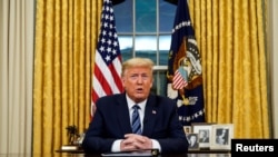 President Donald Trump speaks about the U.S response to the COVID-19 coronavirus pandemic during an address to the nation from the Oval Office of the White House in Washington, March 11, 2020.